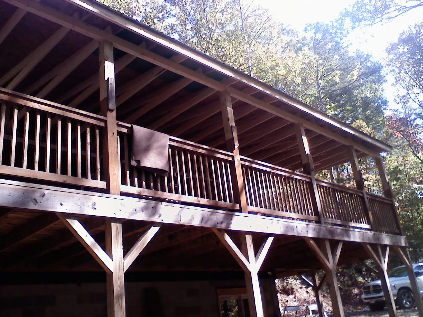 Timber framing under a new elevated porch and deck — Roof Leak Repair in North Windham by Roofing Brothers